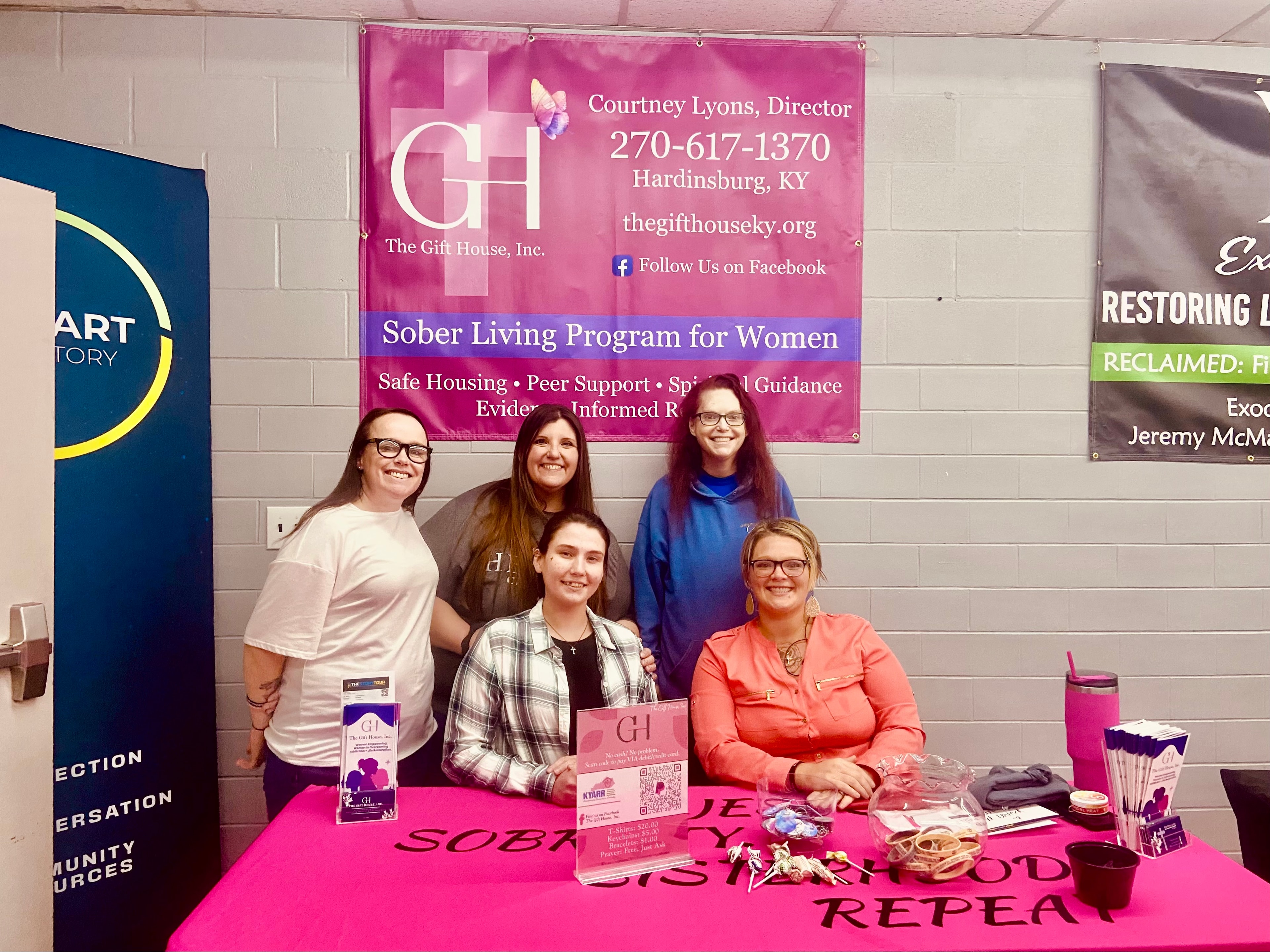 Gift House team at a community outreach event booth