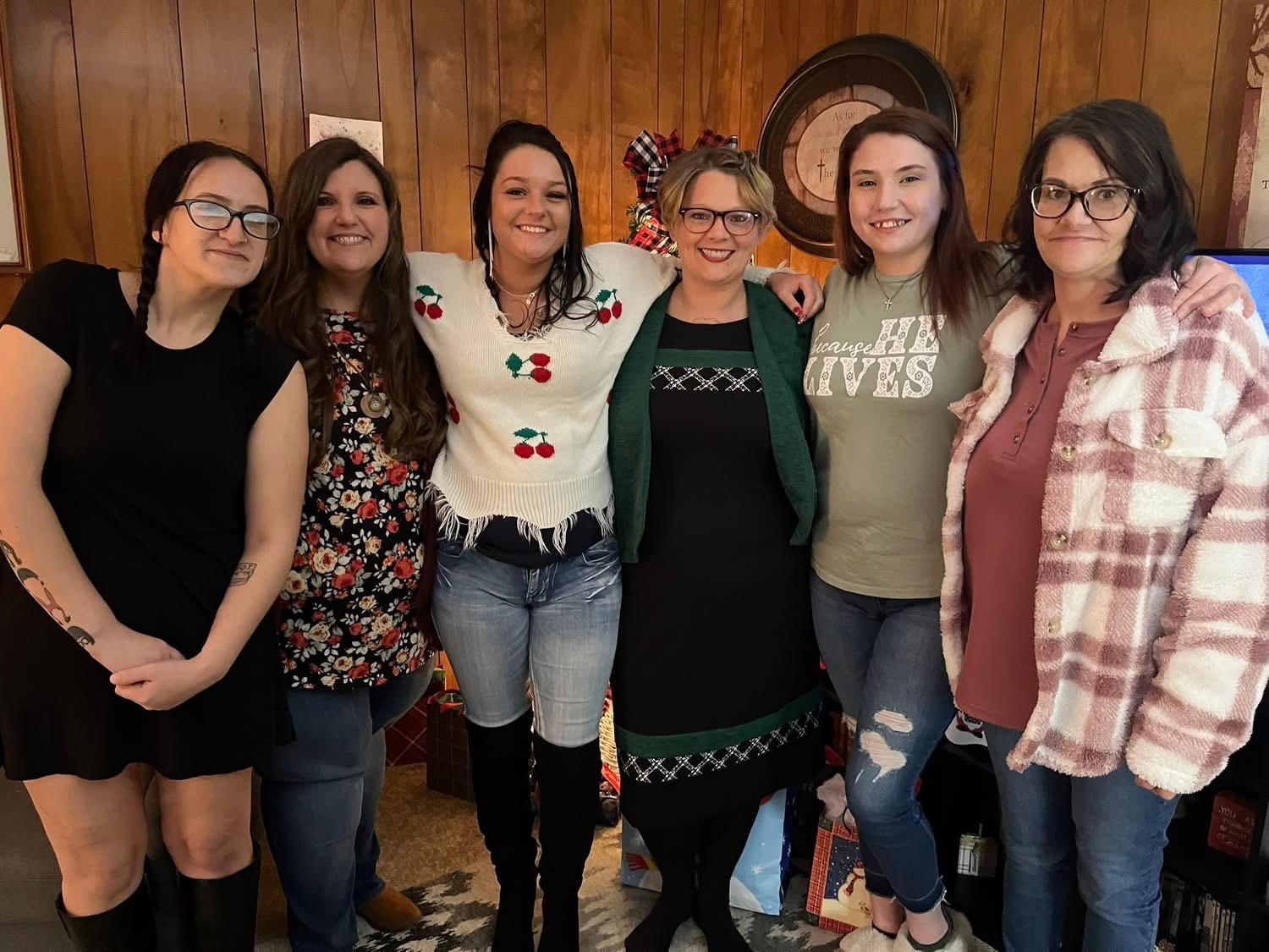 Gift House women gathered together indoors at a holiday celebration